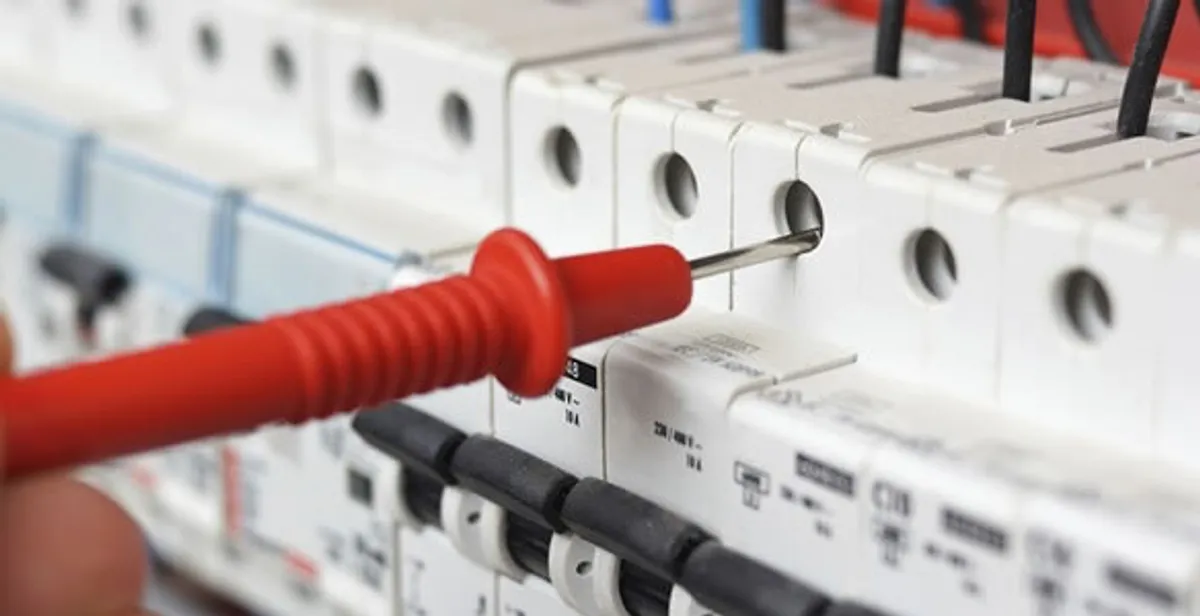 Electrical contractor testing circuit breakers during electrical repair in Fairdale, KY