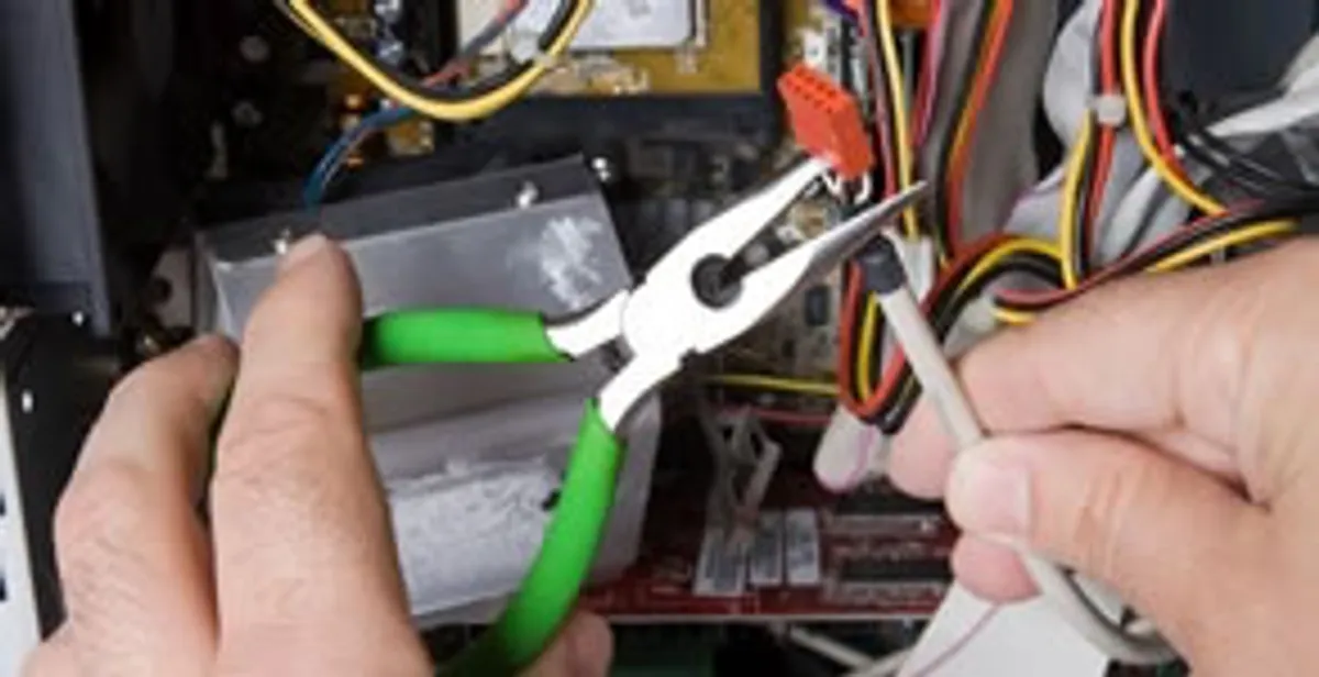 Licensed electrical contractor performing electrical repair with tools in Brooks, KY